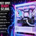 A white mid-tower gaming PC with a glass front and side, lit blue and magenta with white lightning arcing across the interior, beside a spec list reading RTX 5060 Ti 16GB, Ryzen 5 9600X, 16GB DDR5 6000, Samsung 990 PRO 1TB, 750W 80+ Gold and seven ARGB PWM fans.